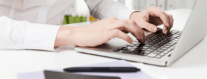 Person Typing on Computer